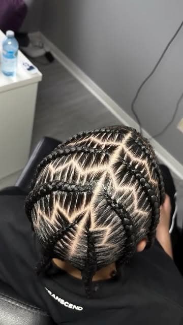 Feed-in cornrows braided into a fanned geometric pattern across the scalp.